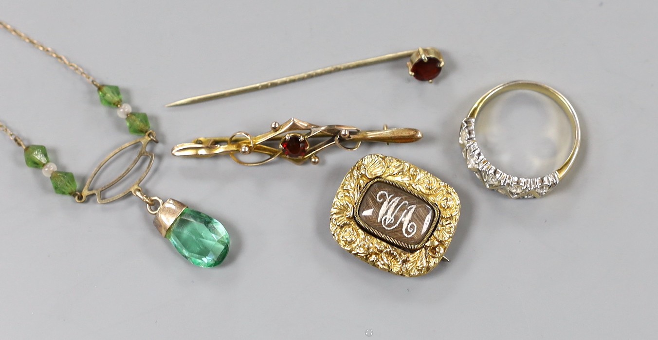 A George III yellow metal and plaited hair mourning brooch, initialled 'WA' and inscribed 'Eliz. Robinson obt. 5th July, 1815 at 12', 22mm, a 9ct and gem set bar brooch, a 9ct and green paste set necklace and two other i